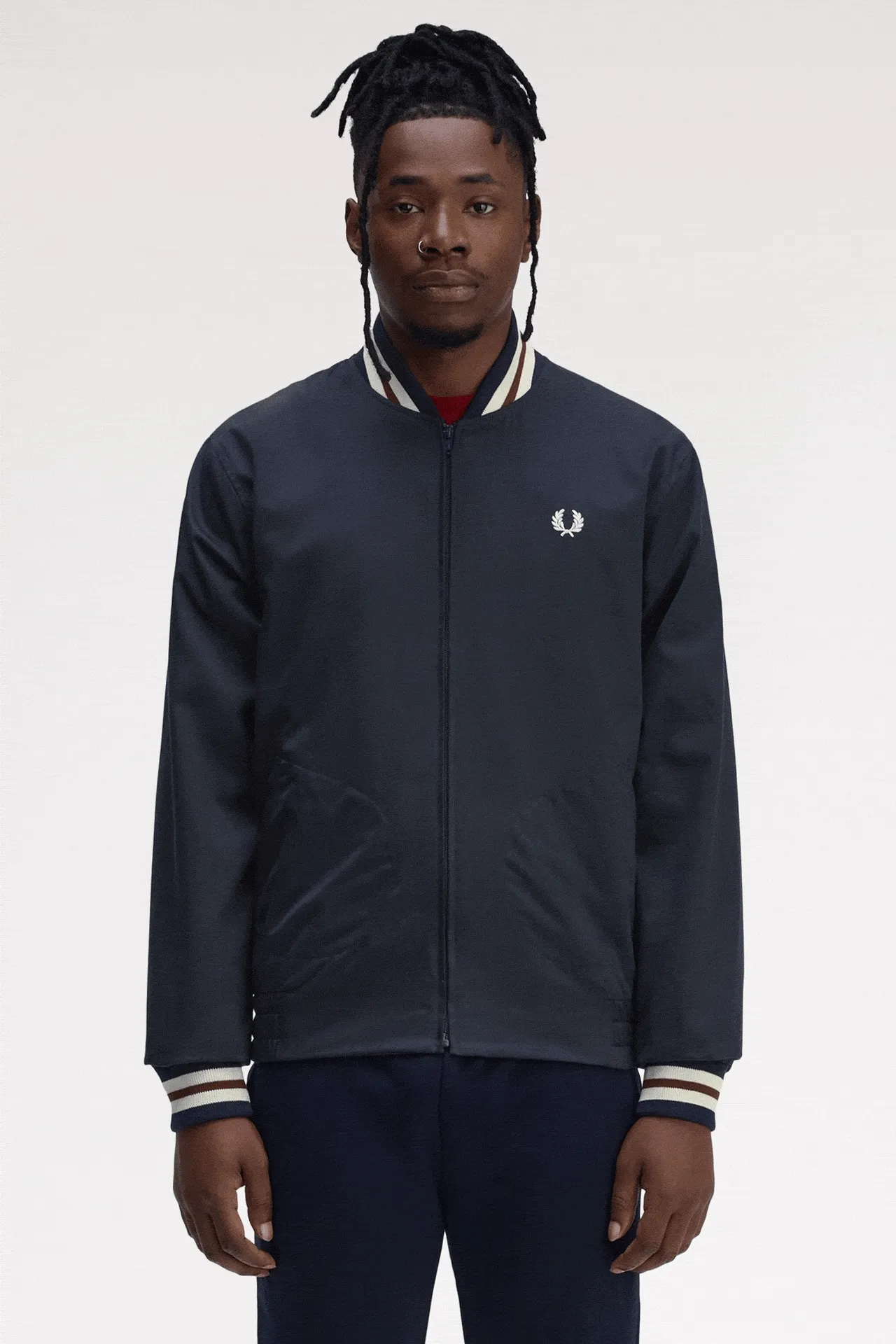 GIF of a male model wearing the Fred Perry Twill Tennis Bomber Jacket