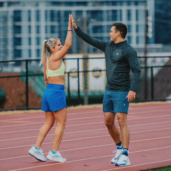 Man and woman high-fiving