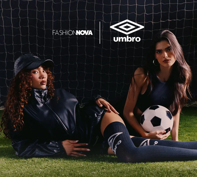 Fashion Nova x Umbro collab: models in black jacket & Umbro socks, with a soccer ball on grass by a goal net.