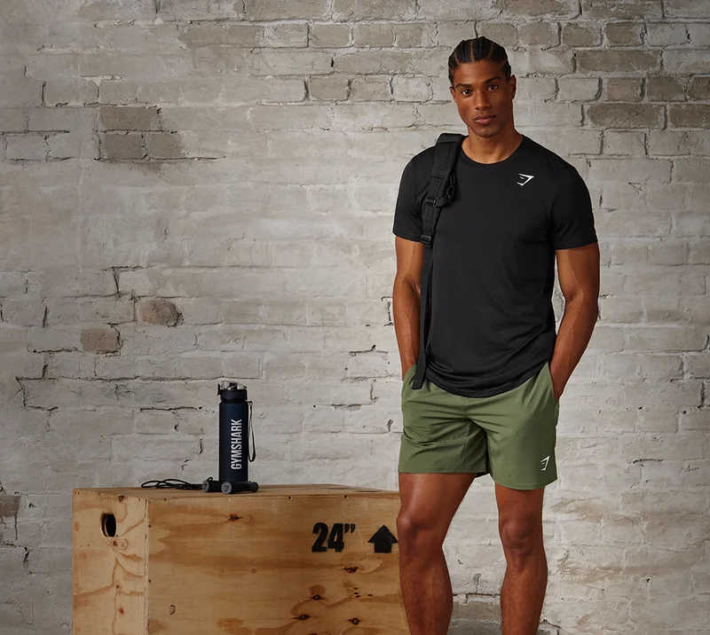 Model wearing Arrival T-Shirt and Shorts.