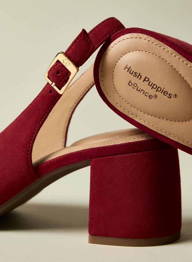 A close up the Red Movena pump's slingback buckle strap, covered block heel, and BounceTM heel cushioning.