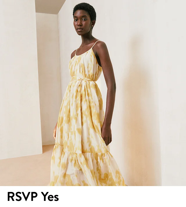 A woman wearing a printed maxi dress