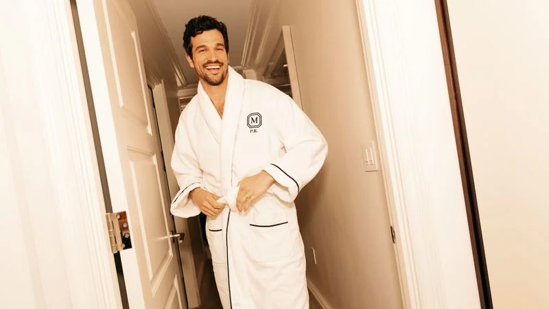 Image may contain: Eddie Cibrian, Fashion, Clothing, Robe, Head, Person, Face, and Adult