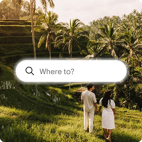 Image Description: Two people walking in the jungle. A “Where to?” search prompt is on the center of the image.