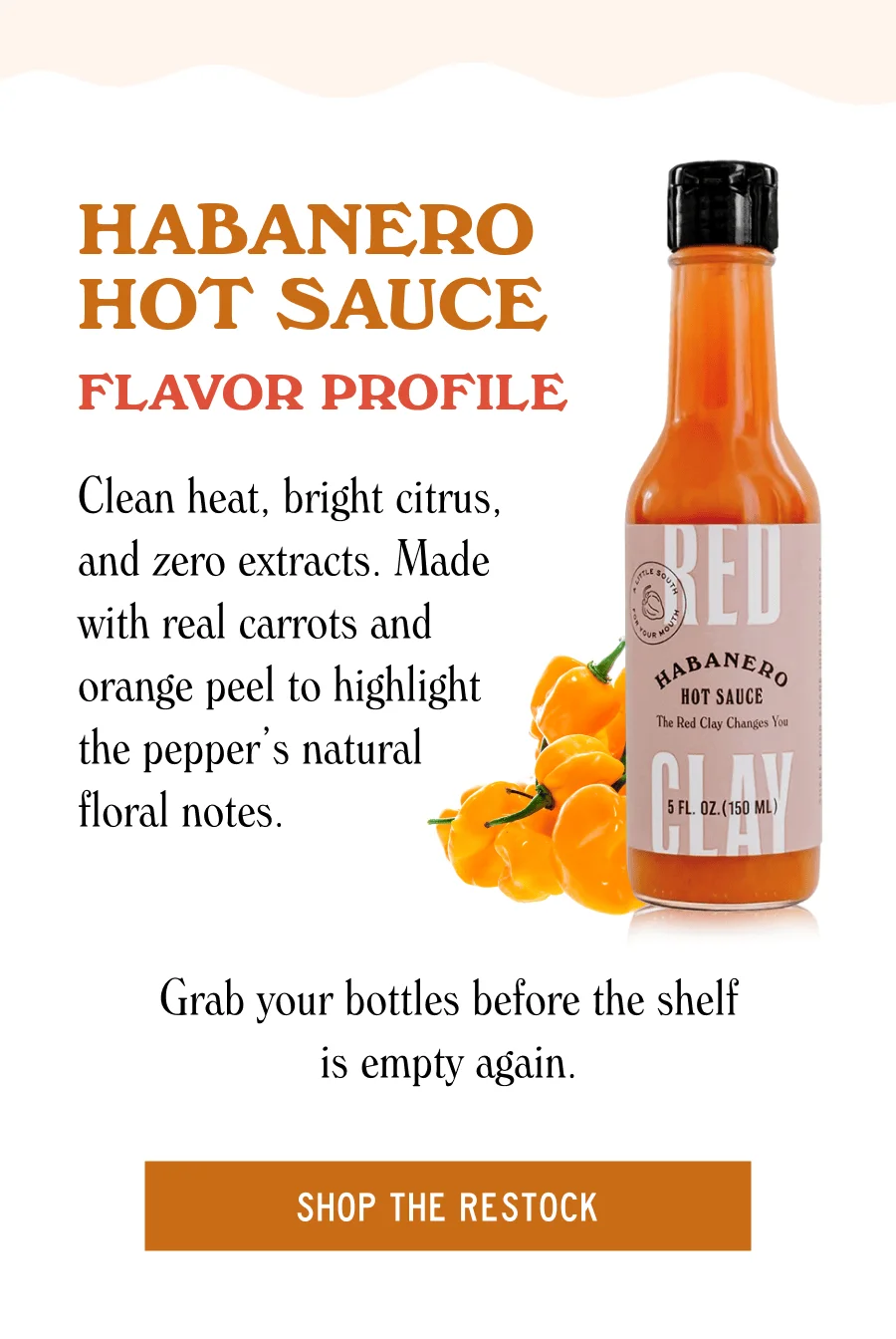 an image of a bottle of hot sauce with oranges on it