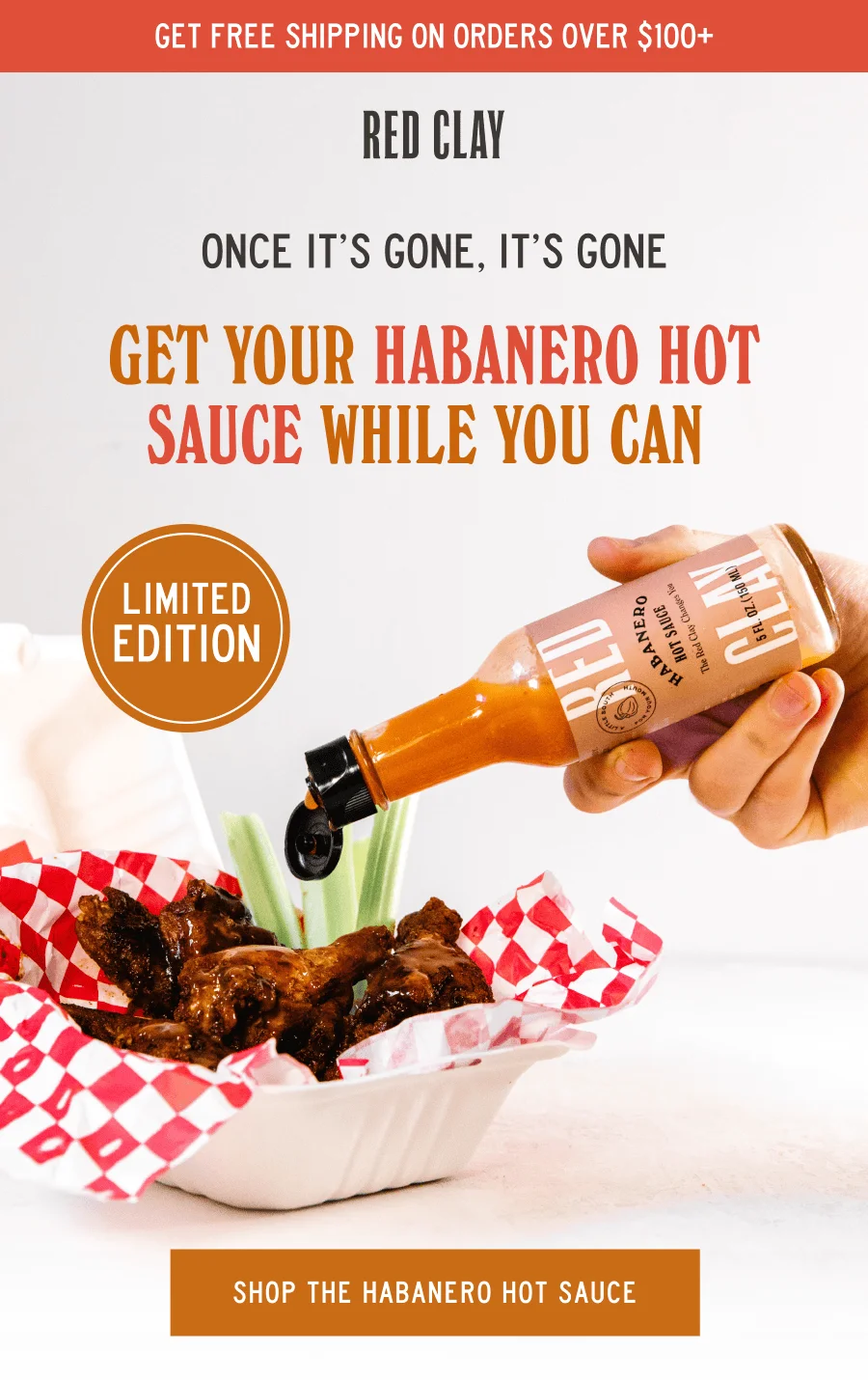 an image of a person pouring sauce on a hot sauce