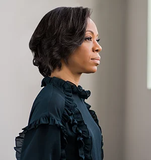 African American Woman prepares for business meeting.