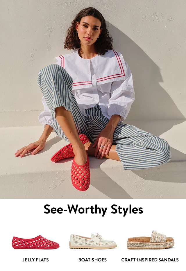 A woman wearing red jelly flats. A red flat. A white boat shoe. A textured slide.
