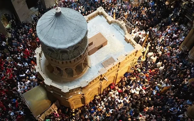 Worshippers in Jerusalem’s Church of the Holy Sepulchre surround the restored Edicule.
