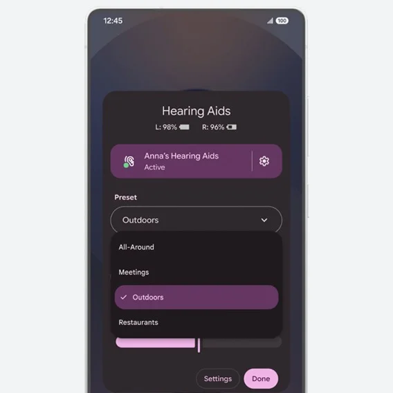 A phone showing the hearing aids management feature on Android, complete with chargeing levels for each aid and presets for environment settings, like outdoors, meetings and restaurants.