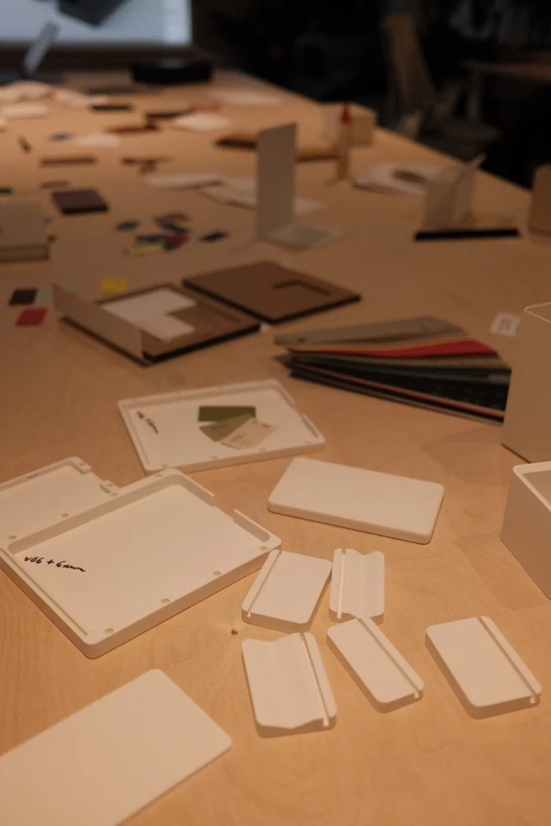 an image of a table with a bunch of cards and a laptop