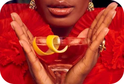 Woman holding a cocktail glass.