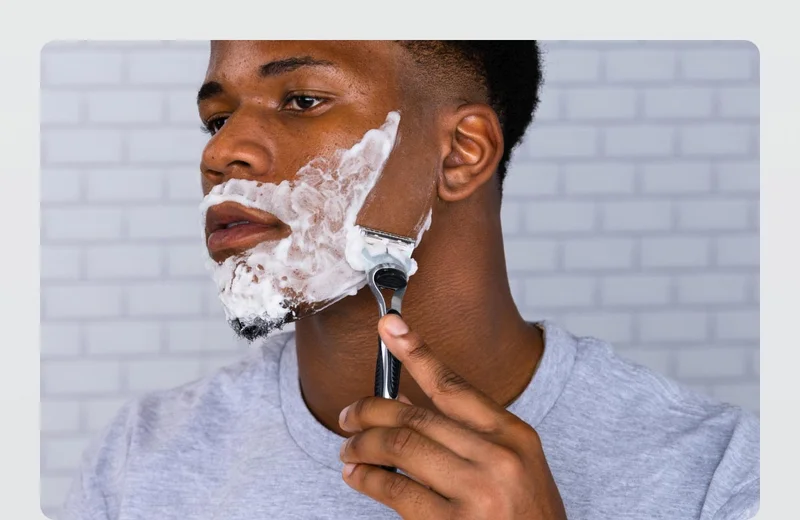 Man shaving his face with Gillette razor