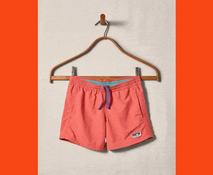 Used to be cool. Still is. A rotating gif of three photos. First photo: a pair of Baggies Shorts on a hanger. Second photo: a smiling, mud-covered young person wearing a shirt, shorts and rain boots. Third photo: an archival photo a Patagonia catalog showing a shirt, four pairs of shorts and a short ode to migrating salmon.