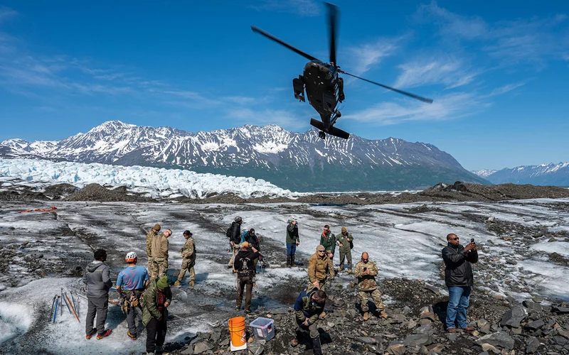 An Alaska National Guard helicopter takes off at Colony Glacier, Alaska