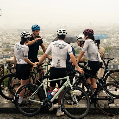 Antoni Porowski chats with members of the Montmartre Velo Club after cycling through the streets of Paris.