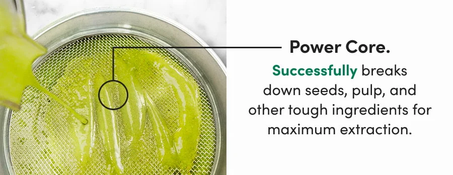 An overhead shot of a bright green smoothie being poured through a fine-mesh metal strainer, with a black circle highlighting the texture of the liquid.