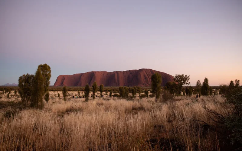 Uluru, a sandstone monolith, is a UNESCO World Heritage Site. It is a sacred place to the Indigenous Anangu people, who have lived here for more than 30,000 years.