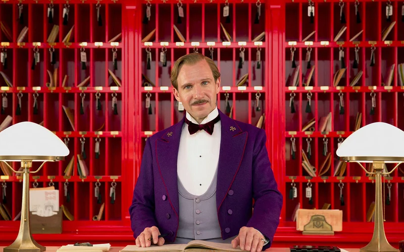 Gustave H, played by Ralph Fiennes, is the eccentric concierge in Wes Anderson’s film The Grand Budapest Hotel.