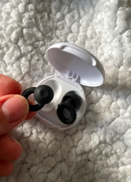 A pair of Black Loop Quiet in a white case.