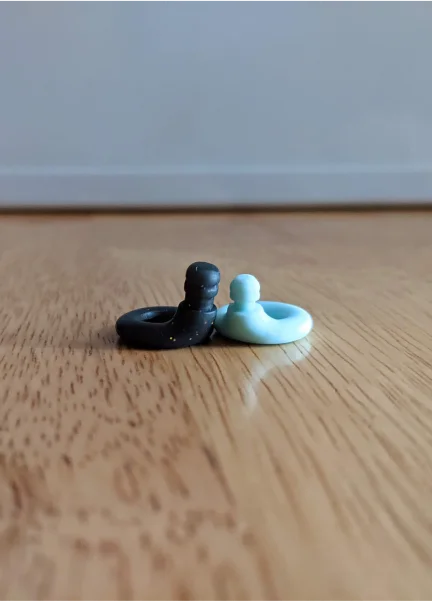 Two Loop Quiet earplugs without the ear tips.
