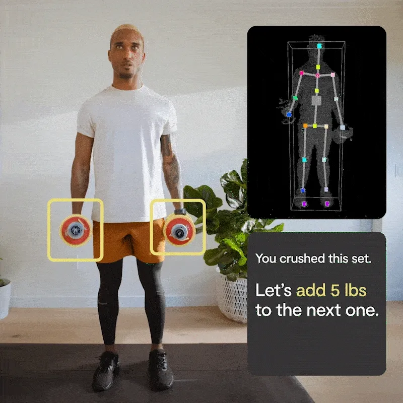 Man working out with Tempo weights showcasing Tempo's smart features