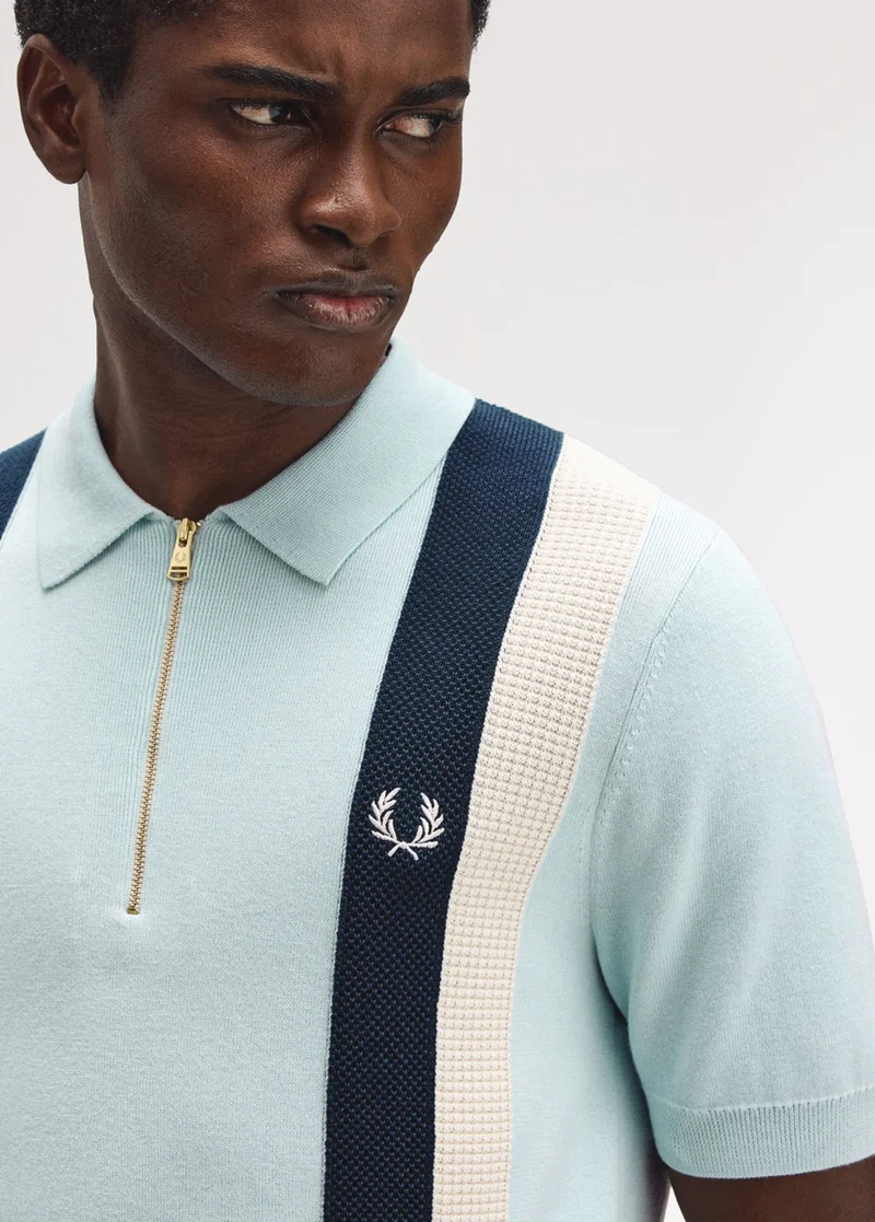 sky blue knitted quarter zip polo shirt with navy and ecru panelling