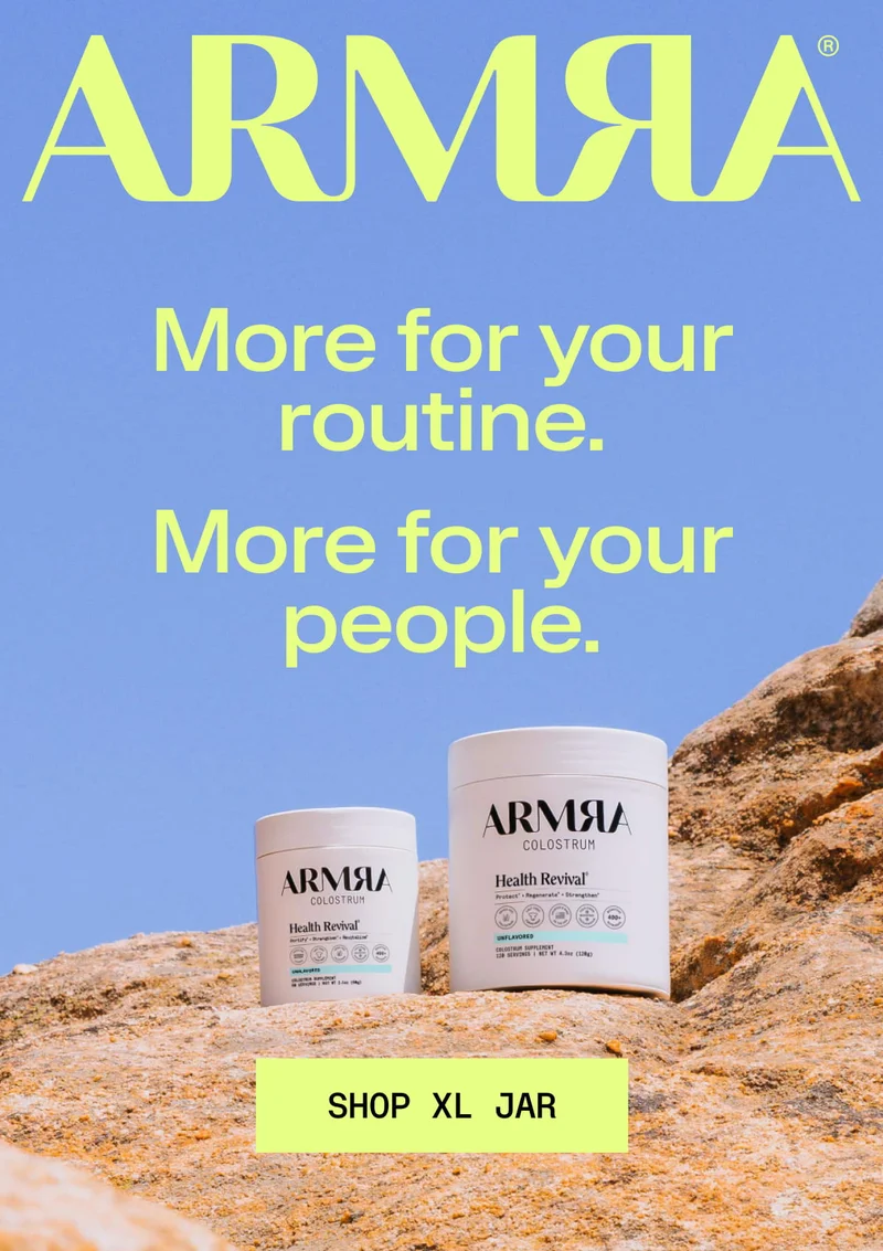 ARMRA Colostrum jars displayed on rocks under a blue sky with headline promoting the XL jar for daily routines and sharing.