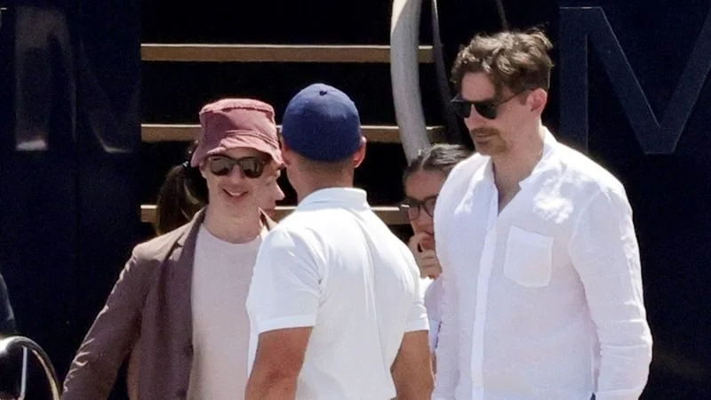 EXCLUSIVE Capri, ITALY Bradley Cooper and Jeremy Strong were spotted disembarking a yacht in Capri with friends. Strong stood out in a bucket hat, echoing his Cannes Film Festival style.