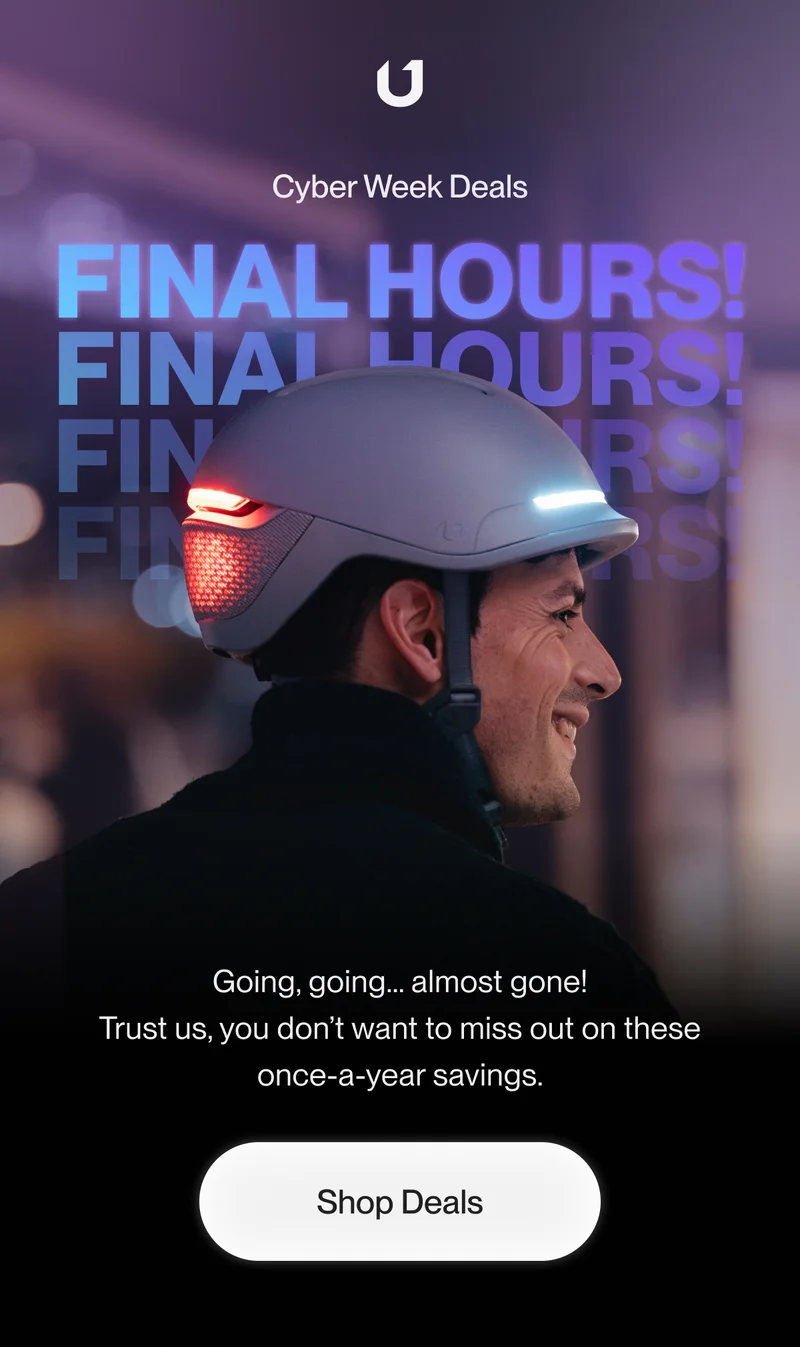 Man wearing a UNIT 1 smart helmet with illuminated front and rear lights. Overlay text reads 'Cyber Week Deals - FINAL HOURS!' in bold, glowing blue and purple letters.
