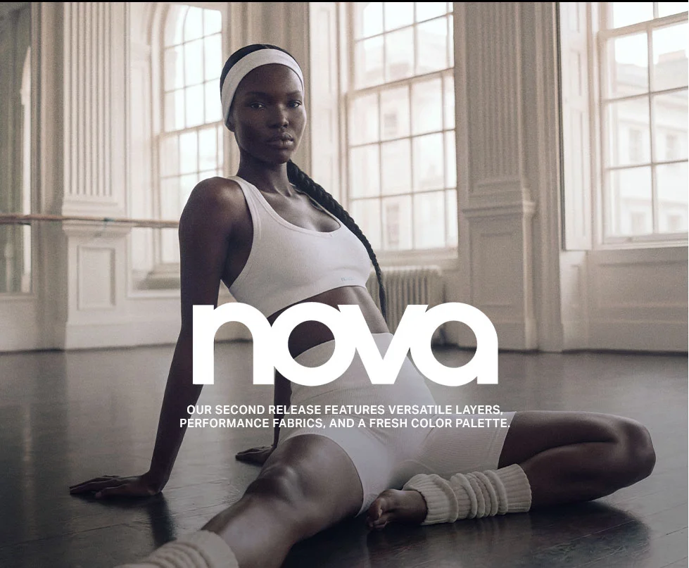 Woman in white Nova activewear, showcasing versatile layers and performance fabrics from the second release. Studio setting.