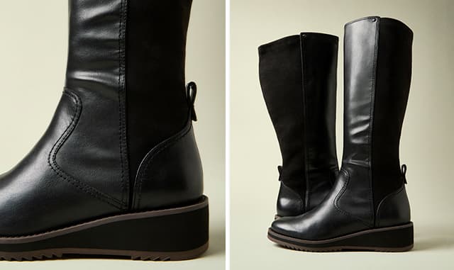 The tall Madi Boot in Black leather designed with a stretch shaft at back and low wedge heel. Shop Madi