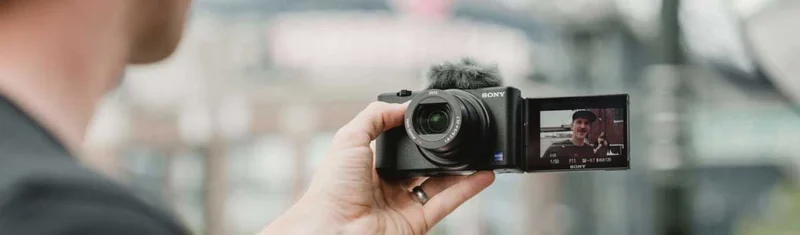 Image of a small Sony camera being used to film a vlog