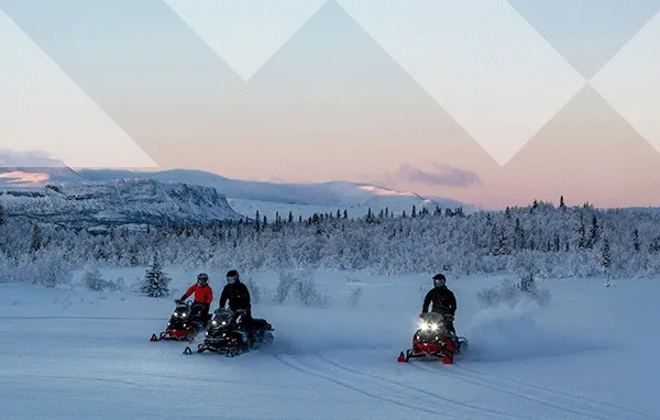 Snowmobile riders outside & SnoWest logo