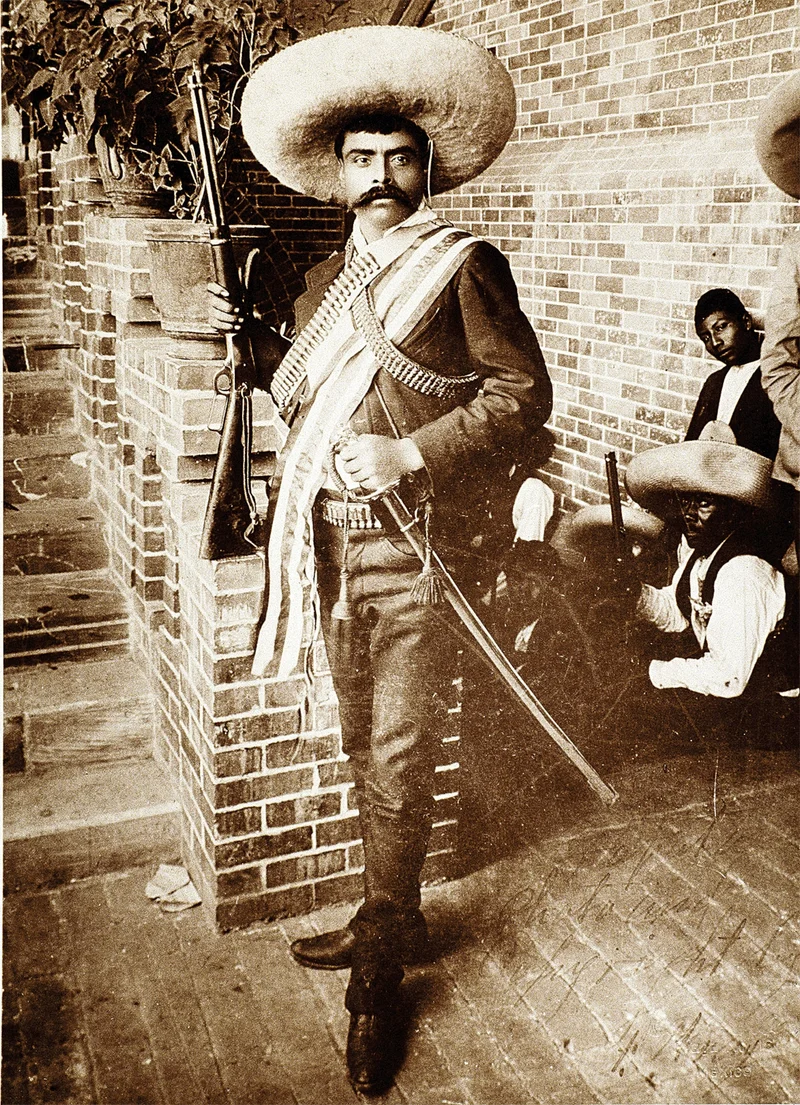Emiliano Zapata stands in his barracks in 1911, wearing his signature charro hat.