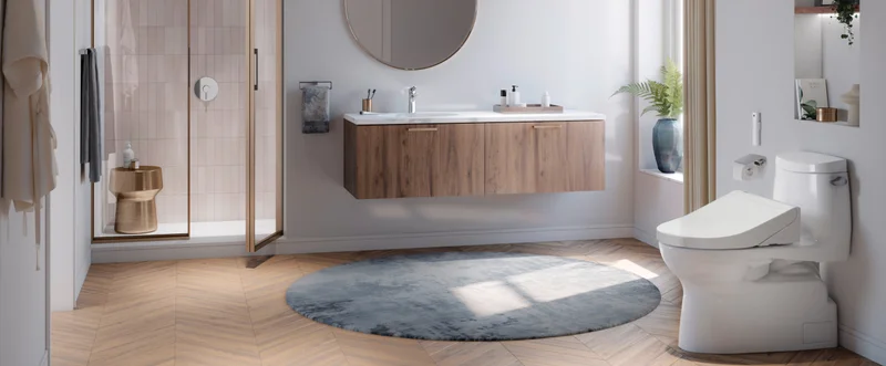 A TOTO WASHLET bidet seat sits in a luxury bathroom.