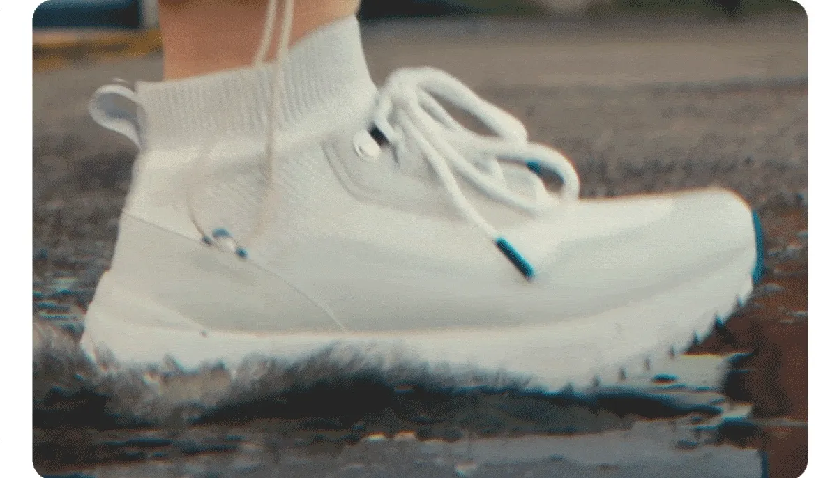 Fully Waterproof. GIF of someone stepping in a puddle.