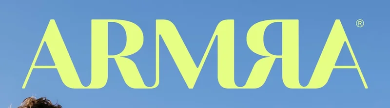 ARMRA logo in bright yellow-green against a clear blue sky.