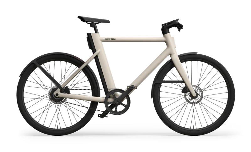 Side profile of a Cowboy Classic in Sand with black wheels, fenders, and handlebar, highlighting its clean lines and modern design.