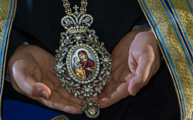 A bejeweled icon, or encolpion, worn by Theophilos III, Greek Orthodox patriarch of Jerusalem and all Palestine, venerates the Virgin Mary and the Christ Child.