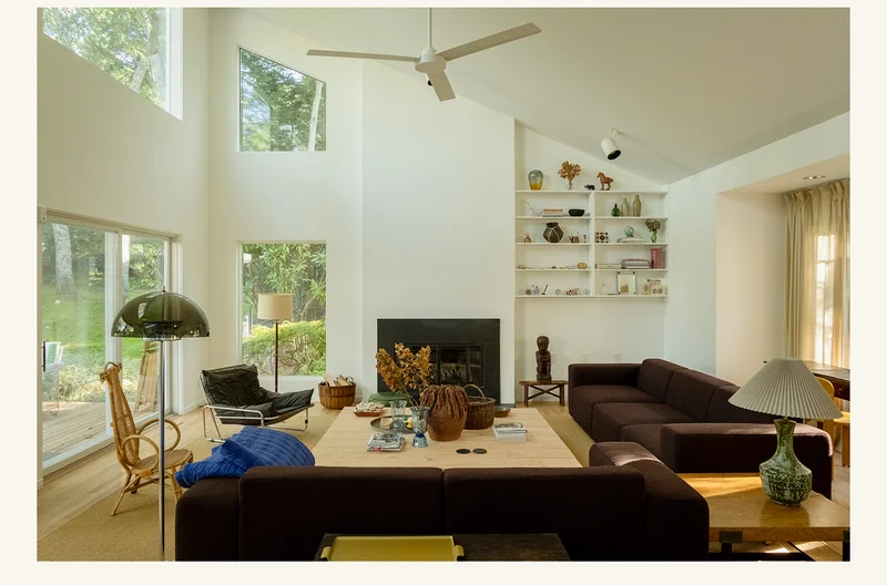 Pictured: A bright airy living room with large windows.