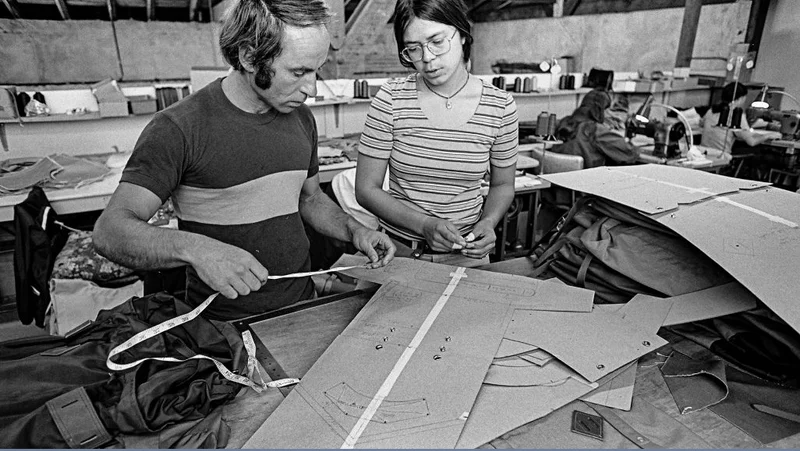 Two people working on a jacket pattern.