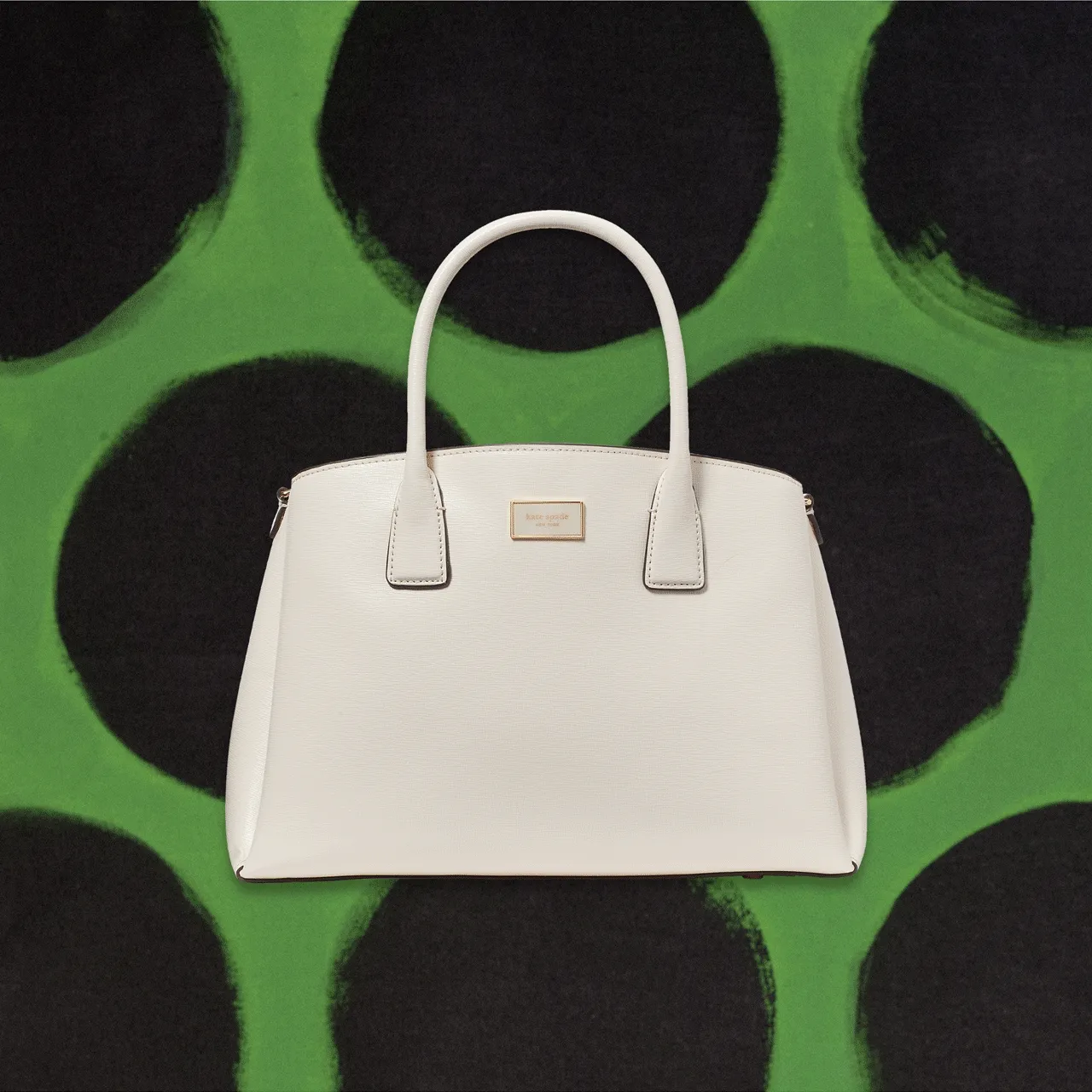 A classic top-handle in sleek (but durable) saffiano leather. Did we mention the outfit-making hues? It's where function meets fabulous.