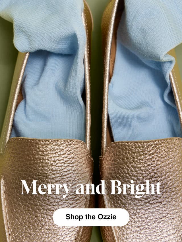 The pebbled leather soft rose gold Ozzie loafer with pale blue socks tucked inside. The text says Merry and Bright  Shop the Ozzie