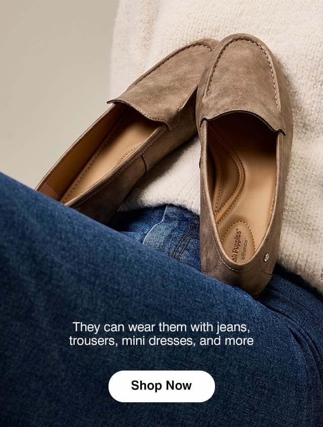 A pair of the versatile Ozzie Loafers in neutral Bronze. The text says They can wear them with jeans, trousers, mini dresses, and more. Shop Now