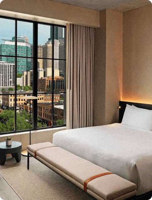 Image Description: The minimalist interior of a deluxe hotel room with city views in Nobu Hotel Chicago