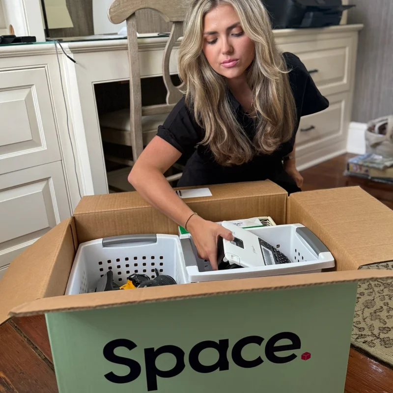 Lady packing a box