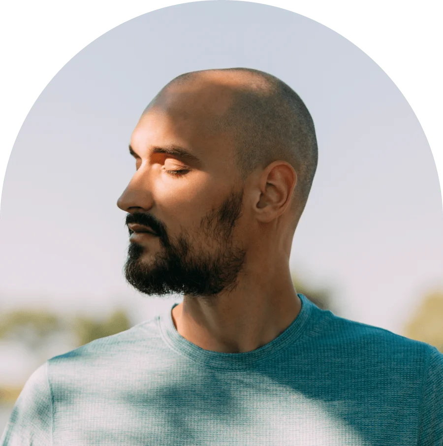 Portrait of a man breathing fresh air in nature