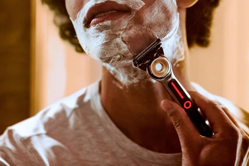 Man shaving his face with GilletteLabs heated razor