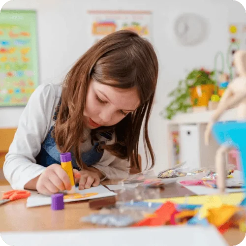 a girl doing art, one of our favorite indoor activities on dreary days